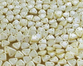 CzechMates™ Cream Triangles 6mm 2-hole, 10 grams