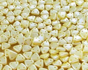 CzechMates™ Cream Triangles 6mm 2-hole, 8 grams