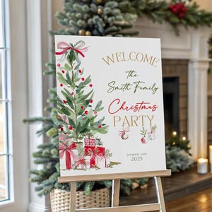 May include: A white Christmas party welcome sign on a wooden easel. The sign features a watercolor Christmas tree, gifts, and the text "WELCOME the Smith Family Christmas PARTY" in gold and red. The date is printed below.