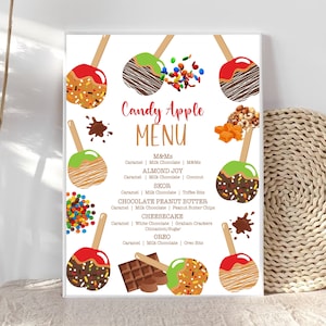 May include: A printable menu for a candy apple bar with illustrations of different candy apple toppings. The toppings include M&Ms, Almond Joy, Skor, Chocolate Peanut Butter, Cheesecake, and Oreo. The menu lists the ingredients for each topping.
