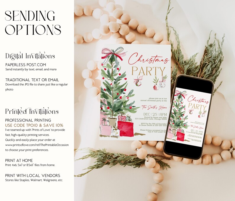 Digital Christmas invitation shown on both phone and printed card, featuring watercolor greenery, ornaments, and gifts in shades of red, pink, and gold. Displayed on a clean white tabletop beside wooden beads and greenery, demonstrating both print and digital sending options for a modern, versatile holiday invite.
