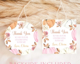 May include: Two round thank you tags with a fall theme. The tags feature a pink and white background with watercolor pumpkins, leaves, and flowers. The text on the tags reads "Thank You So Much For Celebrating With Me! Love, Olivia".