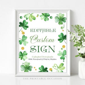 May include: A framed print with a white border features green shamrocks and gold accents. The text "EDITABLE Custom SIGN" is displayed in green script. Additional text reads "Unlimited Downloads, Edit, Download & Print in Minutes."