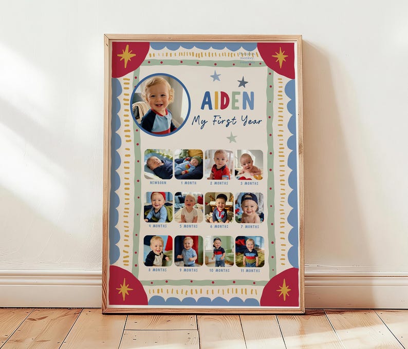May include: A rectangular poster in a wooden frame featuring a photo collage titled "Aiden My First Year." The design includes a large circular photo at the top, followed by twelve smaller square photos labeled from newborn to eleven months.