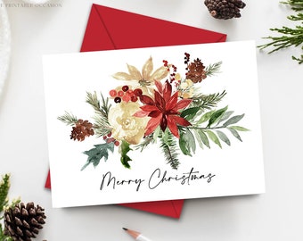 Peut inclure: Carte de Noël blanche avec un motif floral à l'aquarelle représentant des poinsettias rouges, des pommes de pin et de la verdure. Les mots "Merry Christmas" sont écrits en script noir. La carte est accompagnée d'une enveloppe rouge.