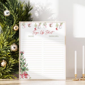 May include: A white sign-up sheet with a light wooden frame featuring a watercolor Christmas theme. The top displays hanging ornaments and the text Sign Up Sheet, while the bottom left shows a decorated pine tree and gifts with lined columns.