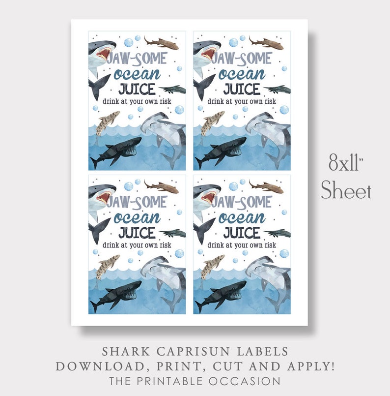 May include: Printable 8x11 inch sheet of four shark-themed Capri Sun labels. Each label features a blue watercolour background with sharks, fish, and bubbles. The text on the labels reads "JAW-SOME ocean JUICE drink at your own risk".