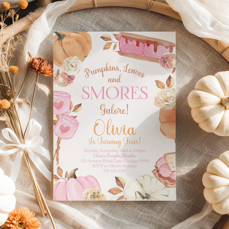 Photo 1

Editable Pumpkin and Smores Birthday Invitation displayed flat inside a large natural embroidery hoop wrapped with soft ivory gauze. White pumpkins, dried florals, ribbon, and textured autumn stems surround the invitation while warm sunlight highlights the watercolor pink pumpkins, toasted smores, marshmallows, and blush flowers. Printable girls fall birthday invitation Canva template with cozy farmhouse styling.