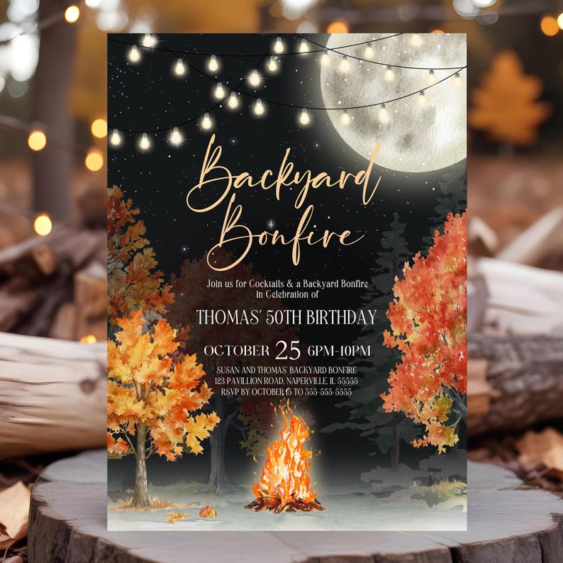 Night sky backyard bonfire party invitation shows hanging café lights, stars, colorful fall foliage, and a glowing campfire illustration. Gold typography stands out beautifully against the dark evening background. Invitation rests on a wooden surface with blurred warm string lights behind it. Rustic outdoor lighting creates an inviting backyard evening atmosphere.