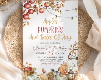 May include: An invitation card with the text "Apples, Pumpkins, And Bales Of Hay" for Olivia's 1st birthday. The design features illustrations of apples, pumpkins, hay bales, and a decorative wheel. The date is October 25th, 2 PM-5 PM.