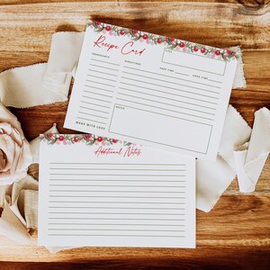 May include: Two white rectangular recipe cards with a festive garland of red berries and green leaves at the top. The top card features the text Recipe Card, Ingredients, Directions, Title, Prep Time, Cook Time, Notes, and Made With Love. The bottom card says Additional Notes.