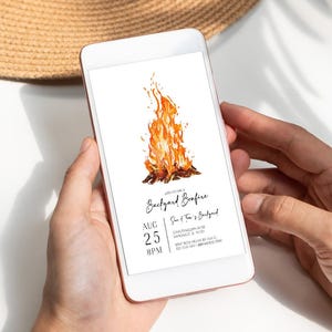 Digital bonfire party invitation displayed on a smartphone with a bright watercolor campfire and modern black lettering. The invitation includes customizable date, time, location and RSVP details for a backyard gathering. The phone is held in hand against a bright neutral background with soft natural shadows. Ideal for sharing a bonfire birthday, outdoor party or backyard bonfire invitation digitally.