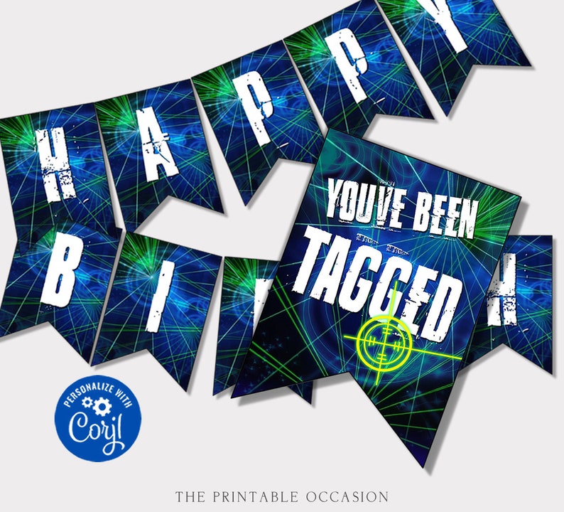 May include: A laser tag themed party banner featuring blue and green light patterns on pennant flags. The white text reads HAPPY BIRTHDAY and YOU'VE BEEN TAGGED, accompanied by a yellow crosshair graphic and a blue Corjl logo in the corner.