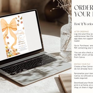 May include: A laptop displays a fall-themed invitation with a large orange bow, pumpkins, and butterflies. The text on the invitation reads "A Little Pumpkin is Turning One!" and includes event details. The laptop is open on a light-colored surface.