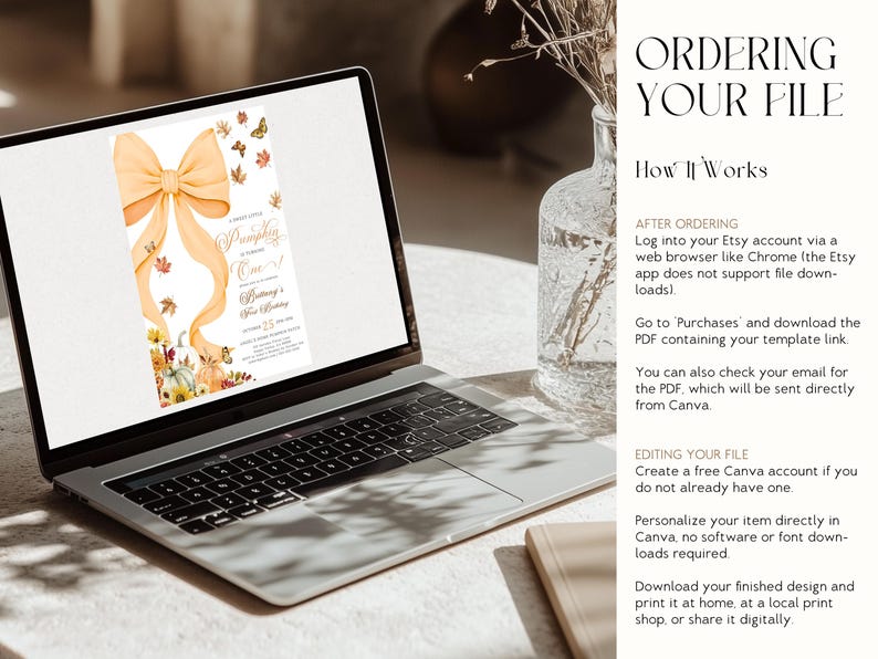 May include: A laptop displays a fall-themed invitation with a large orange bow, pumpkins, and butterflies. The text on the invitation reads "A Little Pumpkin is Turning One!" and includes event details. The laptop is open on a light-colored surface.