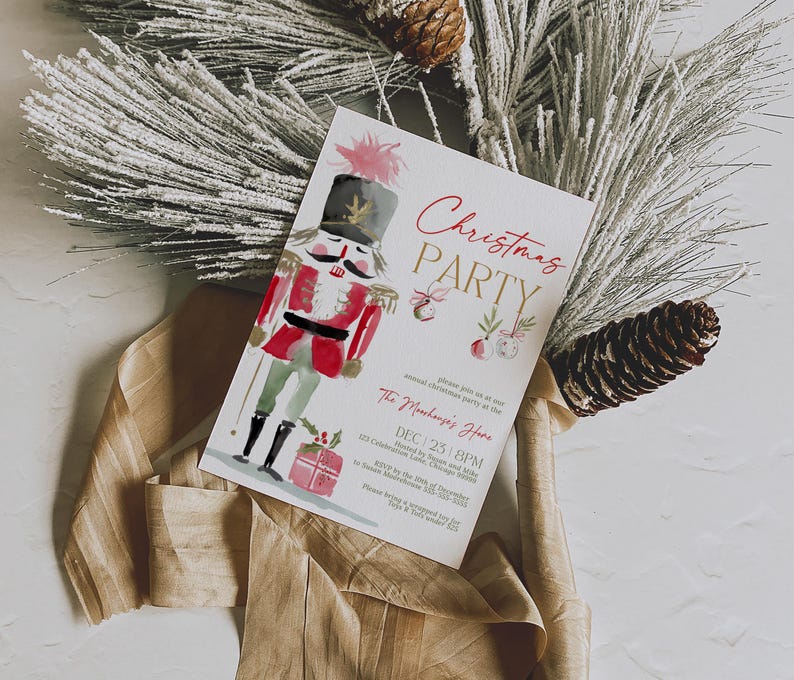 Watercolor Nutcracker Christmas Party Invitation template shown flat on a neutral background with frosted pine branches, pinecones, and ribbon. The elegant design includes red and gold lettering, painted ornaments, and gift illustrations, perfect for a holiday gathering or office Christmas celebration.