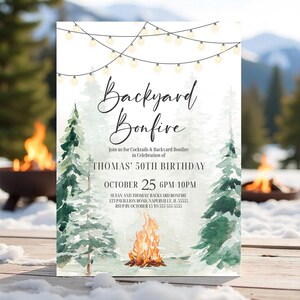 May include: A white invitation card with the text "Backyard Bonfire" in elegant script. The card features watercolor illustrations of pine trees, a bonfire, and string lights. The invitation is for Thomas' 50th birthday on October 25th.