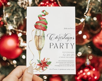 May include: A Christmas party invitation card held in a hand, featuring a champagne glass with an elf hat, and the words "Christmas Party". The card includes event details, such as the date, time, and location.