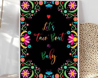 Puede incluir: Impresión enmarcada con fondo negro y borde floral colorido. El texto "Let's taco 'bout a Baby" está escrito en colores arcoíris. Un corazón rojo está encima del texto.