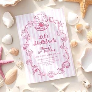 May include: A pink and white striped invitation with the text "Let's Shellebrate Olivia's 15th Birthday" surrounded by a seashell border. Various seashells and starfish are scattered around the invitation on a sandy surface.