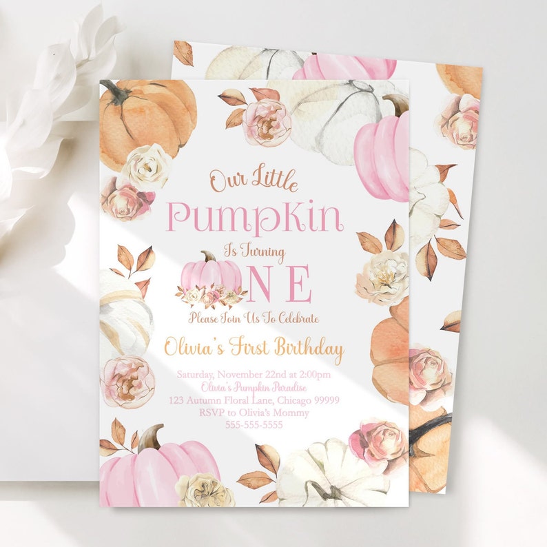 Our little pumpkin first birthday invitation with editable text featuring watercolor pink white and orange pumpkins soft roses and autumn leaves in a feminine fall color palette displayed on a white surface with subtle floral accents for a rustic yet elegant autumn themed first birthday party design for girls