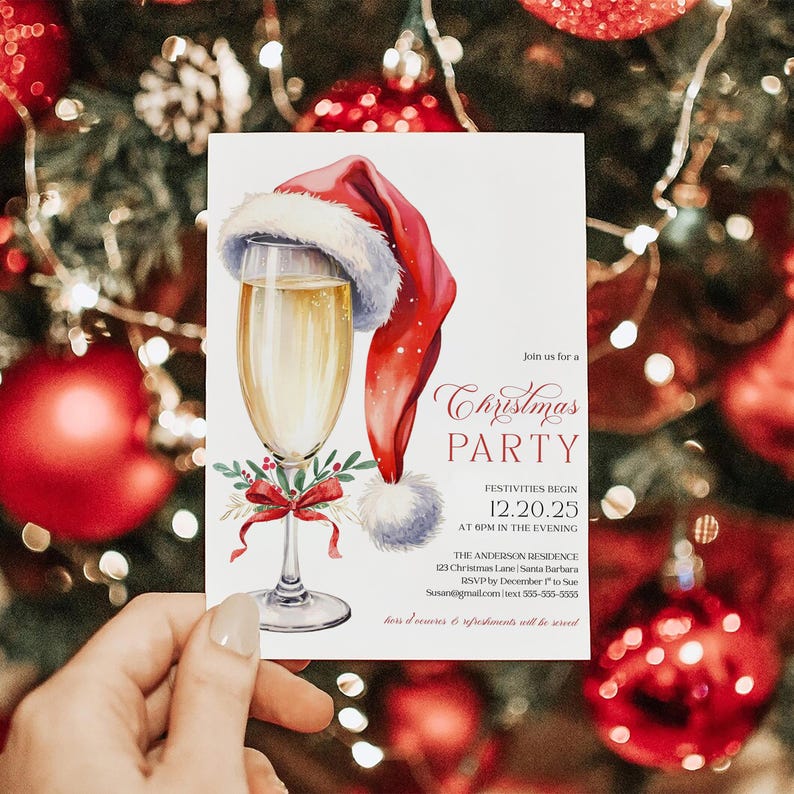 Christmas party invite featuring champagne glass artwork with Santa hat and coquette bow, a trendy choice for holiday cocktail or Friendsmas celebrations. The invitation is editable, making it simple to customize details for an adult Christmas party or elegant evening event. Displayed in front of a Christmas tree with glowing lights and red ornaments, the mockup adds sparkle and holiday cheer.