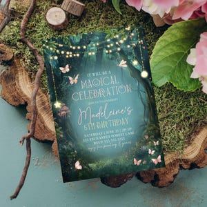 This enchanted forest birthday invitation sits on moss with floral accents, showcasing its fairy garden party style. The woodland birthday invite includes magical fairy lights, butterflies, and enchanted greenery. Editable in Canva, this enchanted birthday party invitation is perfect for a magical girls woodland birthday celebration.