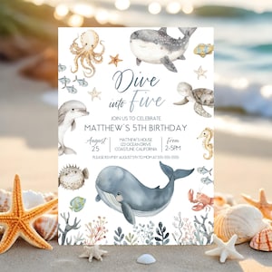 May include: A blue and white invitation card with a watercolor illustration of various sea creatures, including a whale, octopus, dolphin, starfish, and seahorse. The text on the card reads "Dive into Five" and "Matthew's 5th Birthday".