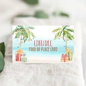 May include: A rectangular card with a tropical beach scene featuring palm trees decorated with string lights and wrapped gifts. The text "EDITABLE FOOD OR PLACE CARD" is in red.