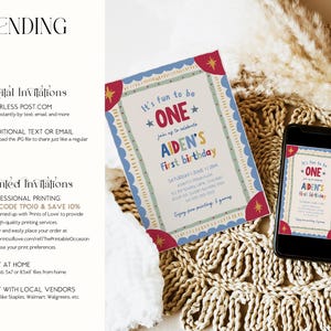 Featuring the digital invitation displayed beside a smartphone screen, this colorful first birthday design highlights playful lettering, hand drawn details, and retro inspired accents. The scene demonstrates how the invitation can be shared digitally by text or email. Woven textures and soft neutral decor create a cozy presentation. The image showcases both printable and electronic invitation options.