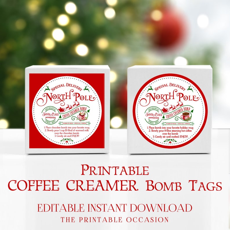 May include: Two white boxes with red circular labels featuring the text "North Pole" and "Coffee Creamer Bomb." Instructions are printed below the logo. The text "Printable Coffee Creamer Bomb Tags" is displayed below the boxes.