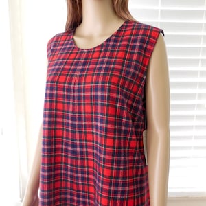 May include: A sleeveless red, black and white plaid dress.