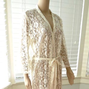 May include: A set of three ceramic mugs with a speckled, matte finish. The mugs are in shades of cream, light gray, and dark gray. Each mug has a simple, minimalist design and a rounded handle.