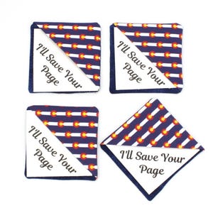 May include: Four square fabric bookmarks with a Colorado flag pattern in blue, white, red, and yellow. Each bookmark has a white triangle with the text "I'll Save Your Page" in black, and a dark blue border.