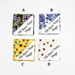 May include: Four fabric bookmark squares with a white triangle on each. The triangles have the text "I'll Save Your Page" printed on them. The fabric patterns are floral, blue and white floral, sunflowers, and red ladybugs on a white background.