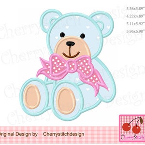 May include: A light blue teddy bear with a pink polka dot bow. The bear has white heart-shaped patterns on its body. The bear is sitting with its legs crossed.