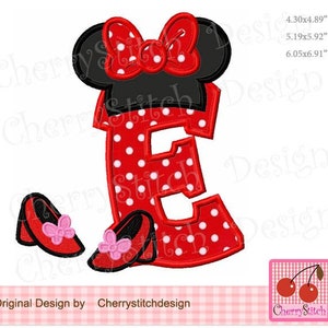 May include: Red and white polka dot letter E with a black and red Minnie Mouse head and bow on top. Two red shoes with pink bows are below the letter. The letter is 6.05 inches by 6.91 inches.