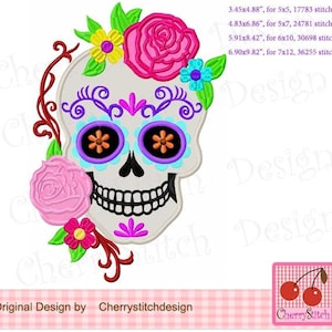 May include: Embroidered design of a sugar skull with pink, purple, blue, and yellow flowers. The skull has black eyes with orange and purple details. The design is perfect for embroidery projects.