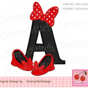 May include: A black letter A with a red and white polka dot bow on top and two red shoes with bows at the bottom. The letter is 4.89 inches by 6.66 inches and has 12617 stitches. The letter is also 5.92 inches by 8.06 inches and has 15233 stitches.