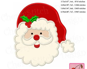 May include: Embroidered Santa Claus design with a red hat, white beard, and rosy cheeks. The design includes holly leaves and berries. The image also includes the text "Cherry Stitch" and "Original Design by Cherrystitchdesign".