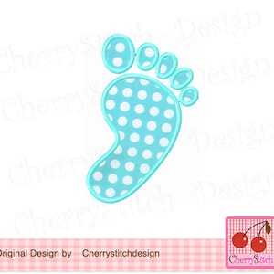 May include: A light blue baby footprint with white polka dots. The footprint is outlined in a darker blue.