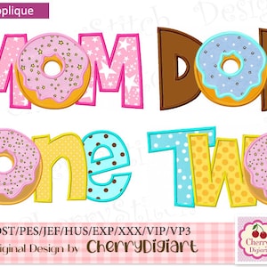 May include: Machine applique design featuring the words "MOM" and "DAD" with donut accents, and "one two" with donut accents. The design uses pink, brown, yellow, and blue colors. The design is for machine applique.