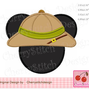 May include: A black and white Mickey Mouse head with a brown safari hat with a green band and a gold buckle. The hat has a brim that extends over the ears. The image includes the text "CherryStitch Design".