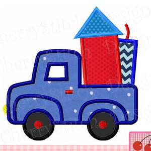 May include: A blue toy truck with white polka dots is carrying a red and blue firework. The firework has a blue pointed top with white polka dots and a red body with white polka dots.