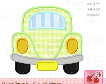 May include: A green and yellow embroidered applique of a car with a checkered pattern. The car has a yellow license plate, headlights, and a rear window. The applique is approximately 6.5 inches wide.