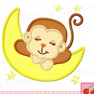 May include: A brown monkey with closed eyes is sleeping on a yellow crescent moon. There are two yellow stars above the moon.