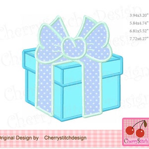 May include: A light blue gift box with a white polka dot pattern and a large white bow with a light blue polka dot pattern. The box is tied with a white ribbon.