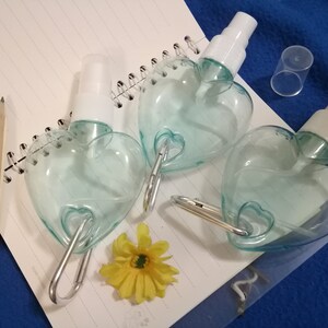 50ml/1.7 oz Transparent Blue Empty SPRAY Bottle with Aluminum Buckle Plastic Heart Shape Spray Bottle Hanging Spray Bottle Clear Hook Bottle Size Comparison with a pencil
