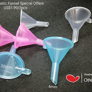 May include: Set of four mini plastic funnels in clear, pink, and blue colors. The funnels are 4.2 inches tall and have a 1.2 inch diameter opening. The funnels are ideal for transferring liquids or small items.