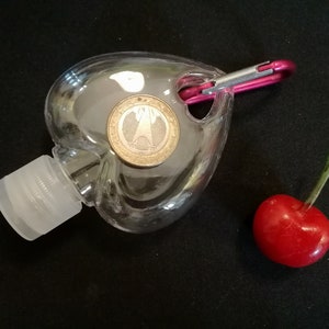 50ml/1.7oz Empty Flip Cap Plastic Heart Shape Bottle w/Buckle Clear hand Sanitizer Bottle Hand Cleanser Empty Flip Hanging Bottle Gel Bottle Size comparison with a Cherry and a coin